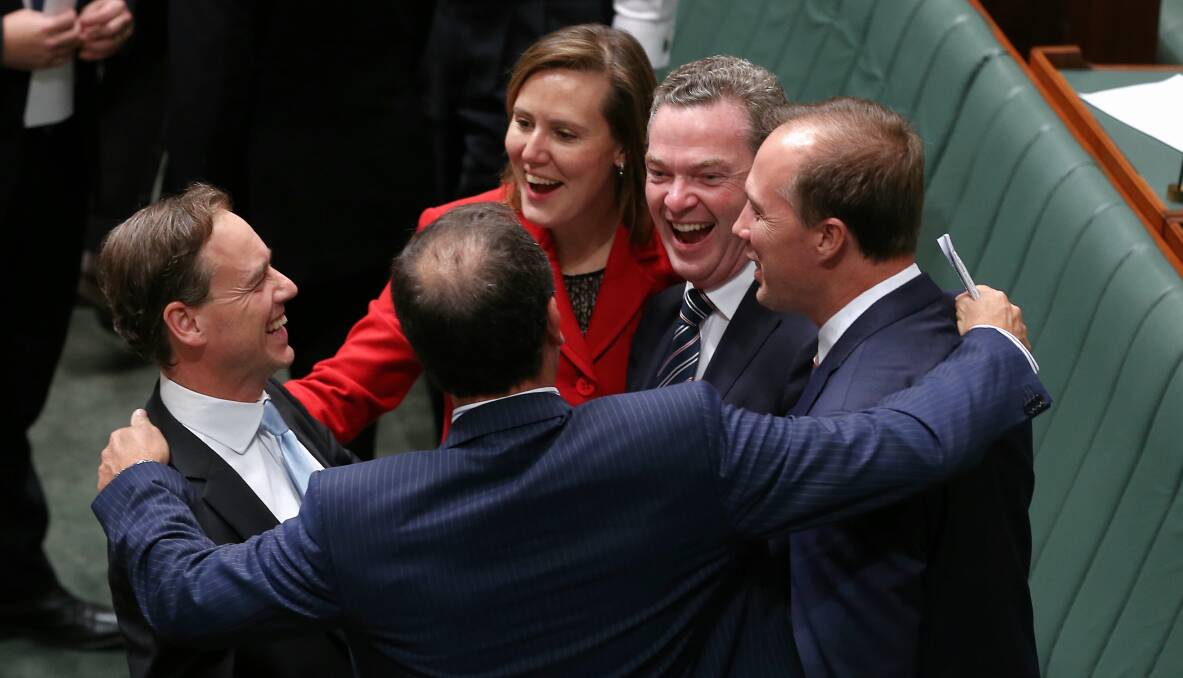 Colleagues congratulate Greg Hunt after Carbon Tax Repeal Bills pass the lower House at Parliament House on Thursday. Picture: ALEX ELLINGHAUSEN