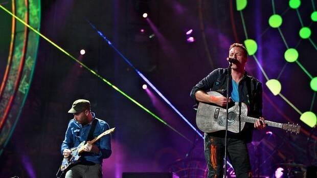 Heading to Sydney: Coldplay in concert during their 2012 Australian tour. Picture: EDWINA PICKLES