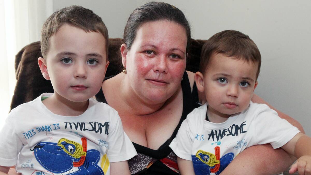 Distressing wait: Corrimal mother Kelly Bolton with two-year-old Alexander (right) and three-year-old Samuel, who is waiting for a surgical appointment in Sydney after suffering rectal prolapse several times since Saturday. Picture: GREG TOTMAN