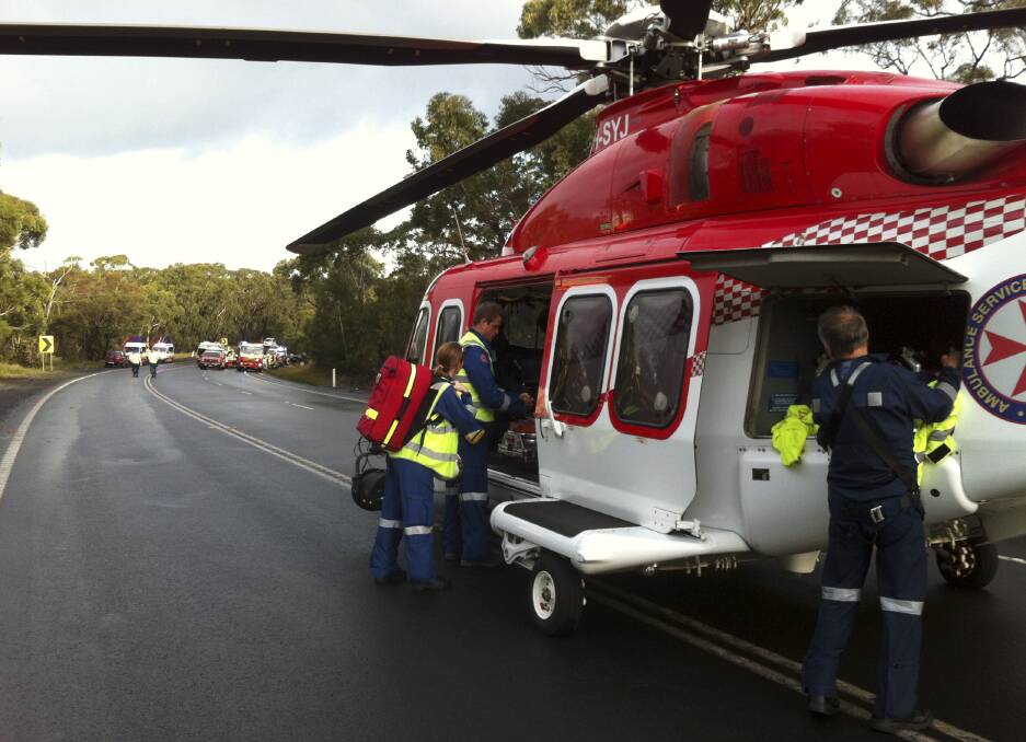 The ambulance chopper arrives at the scene of a fatal 2 car accident on Appin Road. 
