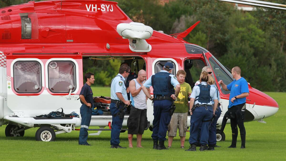 Three men were rescued after a boat capsized at Port Kembla on Friday. Picture: ORLANDO CHIODO