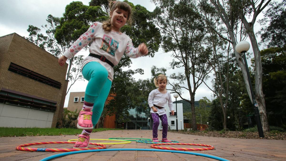 Physical activity monitors capture Mt St Thomas sisters Lucinda, 3, and Amelia Raso’s, 5, every movement. Picture: ADAM McLEAN