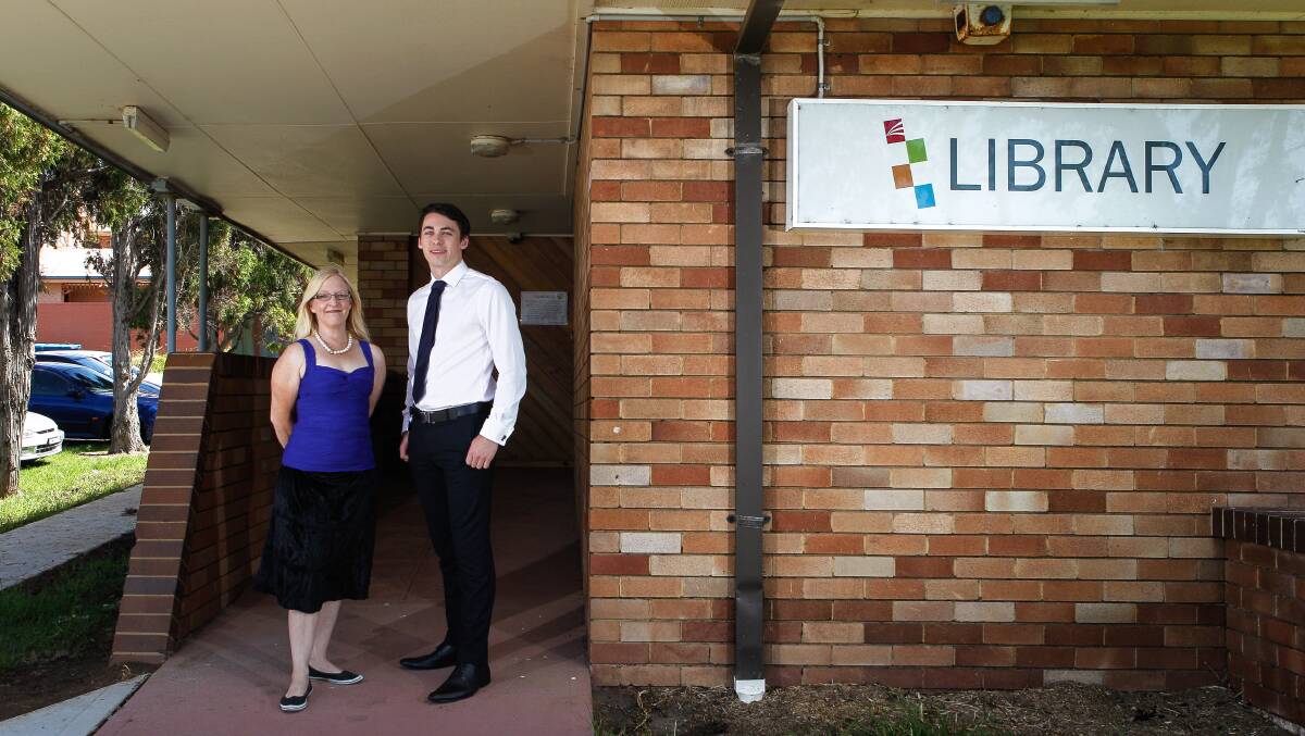 Councillor Kellie Marsh and Mark Jones oppose the library shutdown. Picture: CHRISTOPHER CHAN