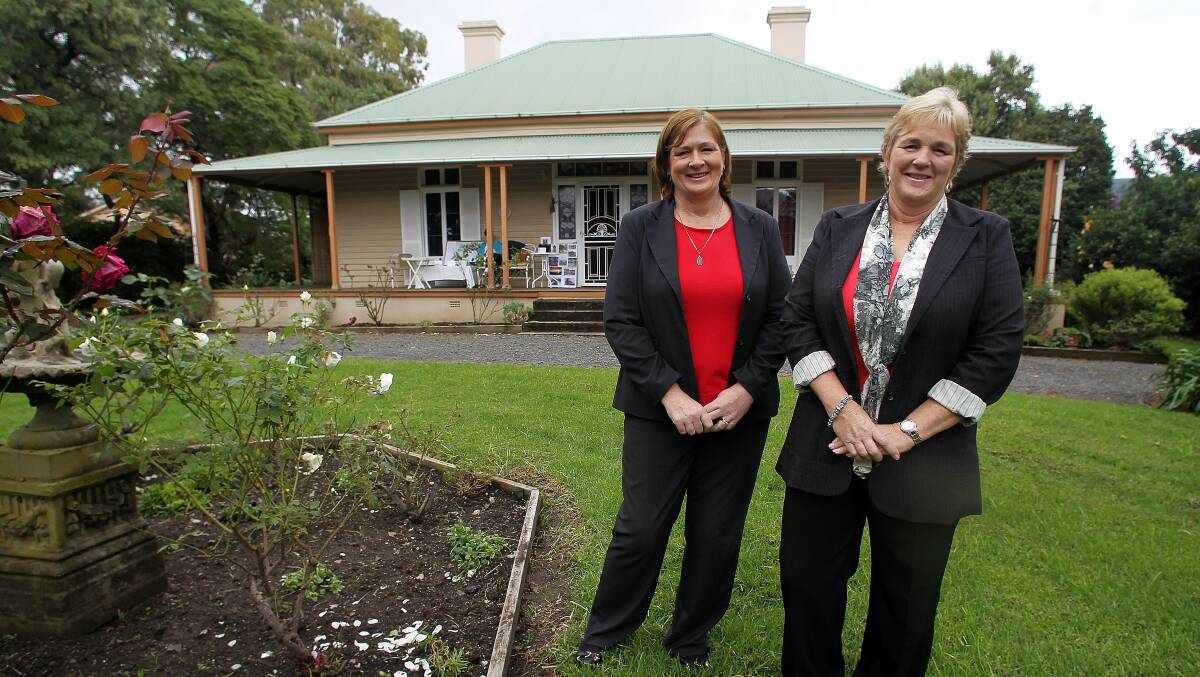 Seven generations: Amanda Brooks and Suzie Katz, descendents of the original owners, in the grounds of Unanderra's historic Nudjia House, built in 1874. Picture: GREG TOTMAN