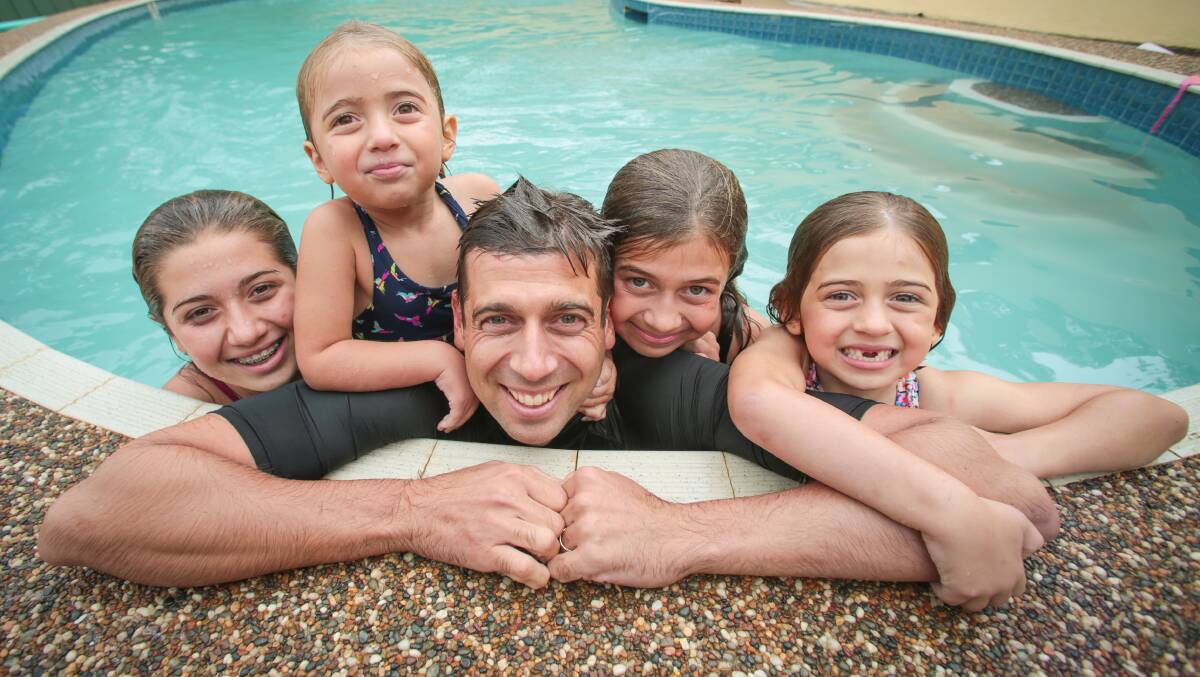 Staying connected: Dr Justin Coulson with his children (from left) Chanel, Lilli, Ella and Annie.ADAM McLEAN