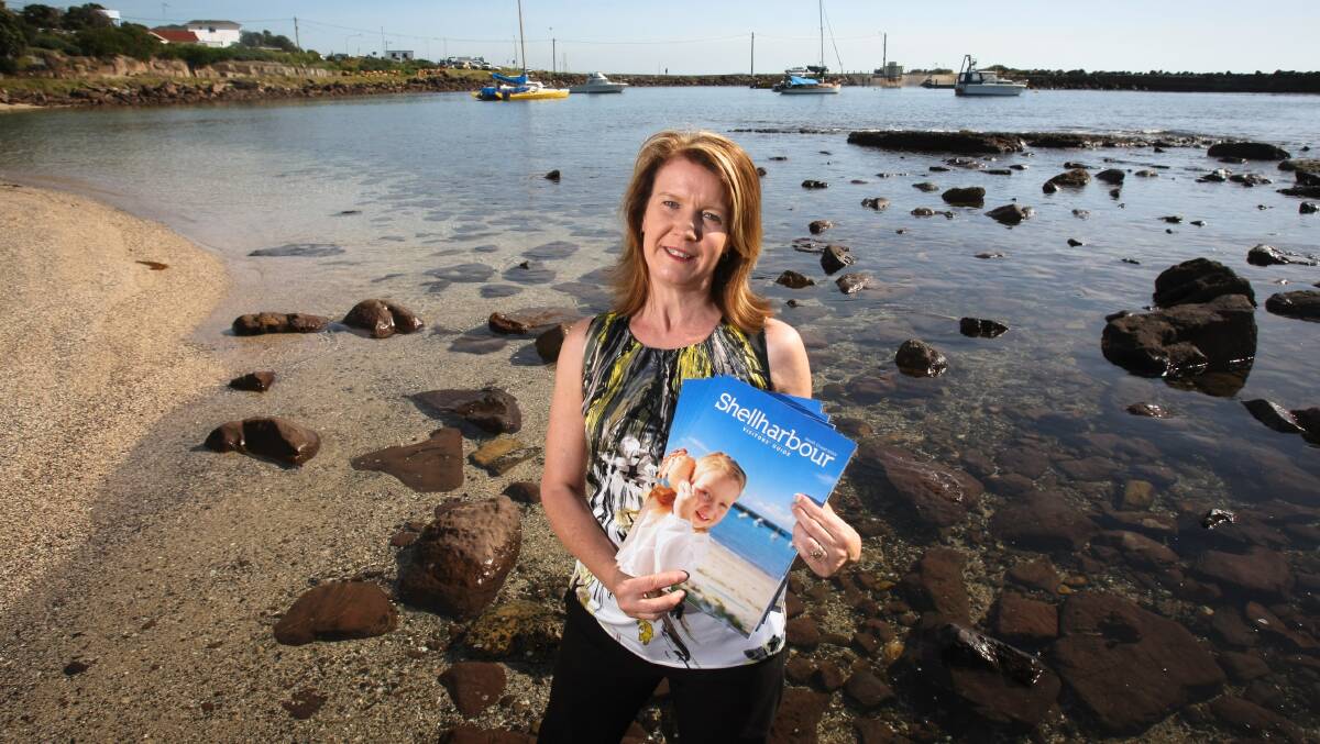 Shellharbour Tourism manager Diane Johnston with the Shellharbour Visitors Guide. Picture: LAKE TIMES