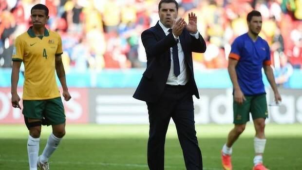 Beaten but unbowed: Tim Cahill and Ange Postecoglou after the Socceroos' 3-2 defeat to the Netherlands. Photo: AFP