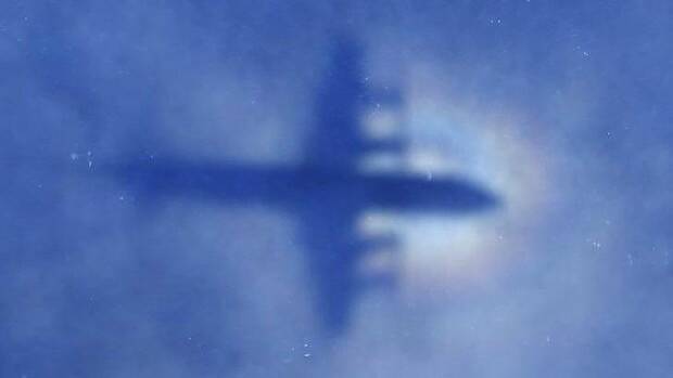 The shadow of a Royal New Zealand Air Force P-3 Orion aircraft is seen on low cloud cover while it searches for missing Malaysia Airlines Flight MH370 in the southern Indian Ocean. Picture: AP