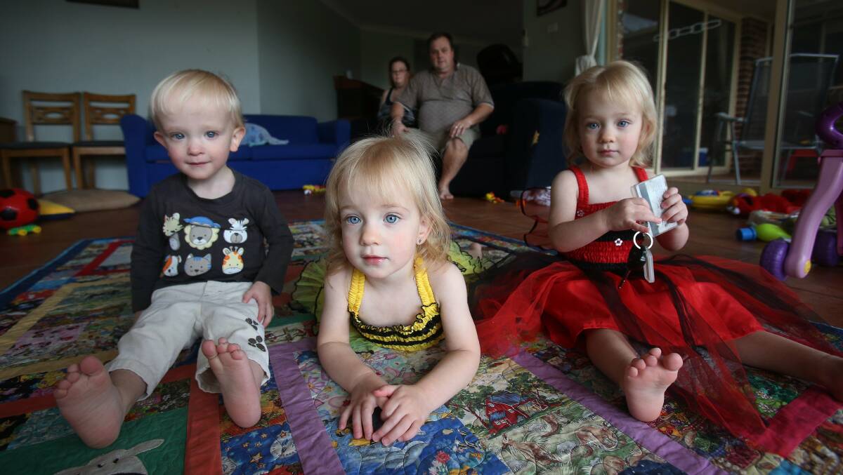 Triplets Cooper, Brianna and Sapphire Smith with their parents Sharon and Stephen Smith. PICTURE: Robert Peet

