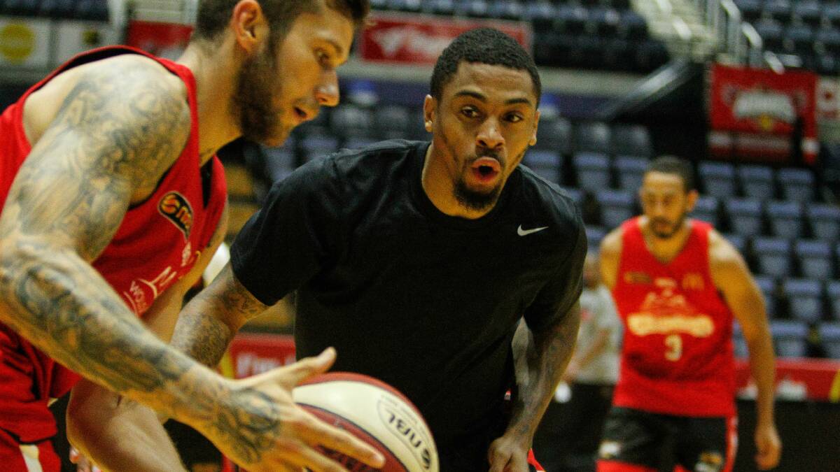 Hawks guards Gary Ervin (right) and Tyson Demos at Wednesday morning's training session.