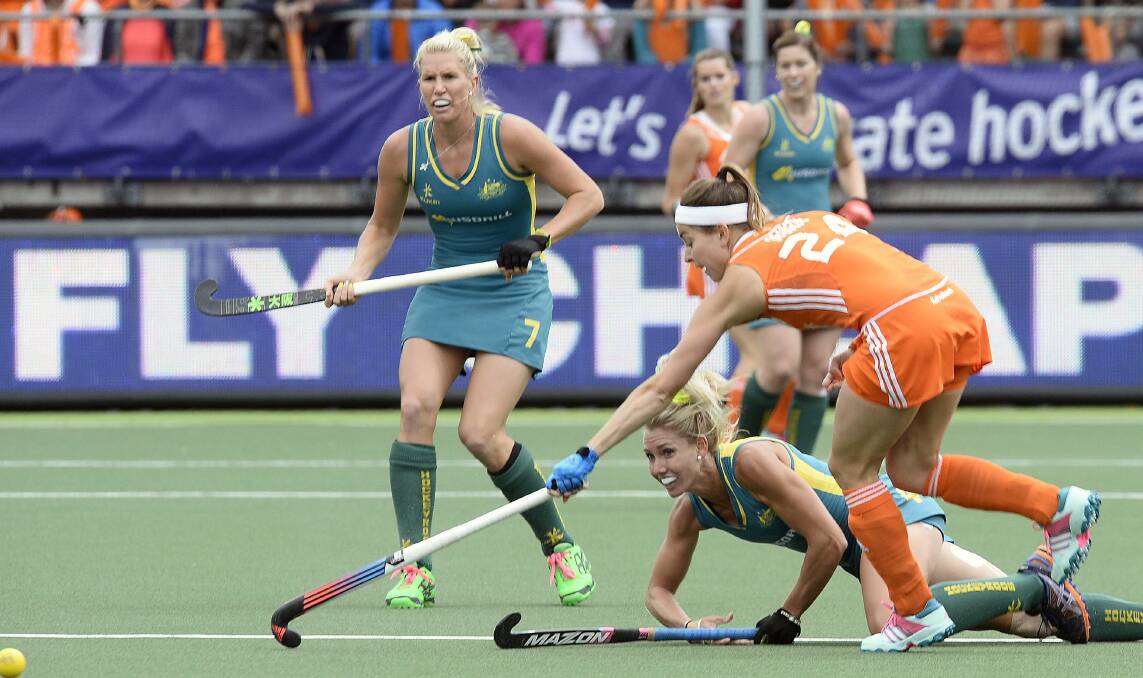 Albion Park junior Casey Eastham dives to prevent her Netherlands rival from taking possession in the World Cup final at The Hague. Picture: REUTERS 