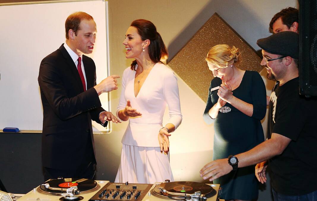 Catherine, Duchess of Cambridge gestures after she used the DJ decks at the youth community centre. Picture: REUTERS