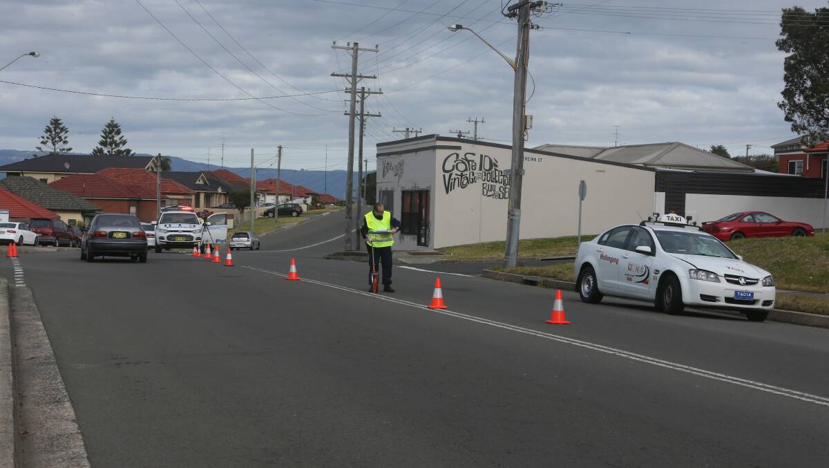 Police attend the scene where a elderly man was hit by a taxi near the corner of Keira and Illawarra streets Port Kembla. Picture: ROBERT PEET