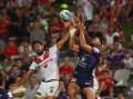 Dane Nielsen of the Dragons and Young Tonumaipea of the Storm compete for the ball. Picture: GETTY IMAGES