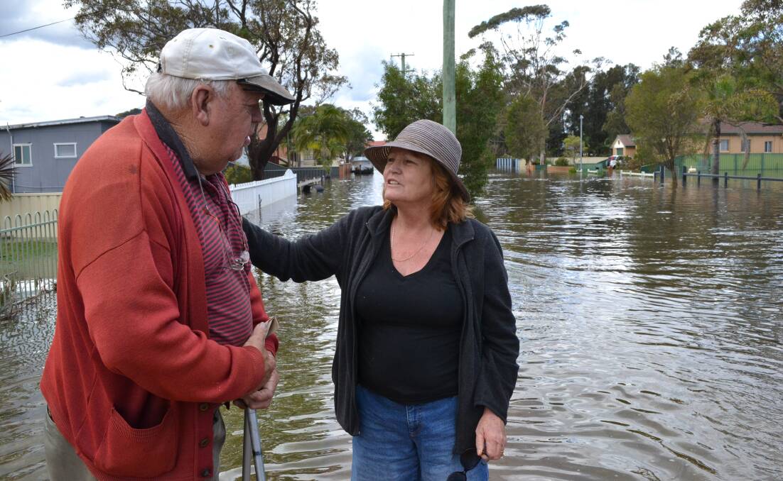 Sussex Inlet resident Julie Sigsworth comforts Jim Chivers.