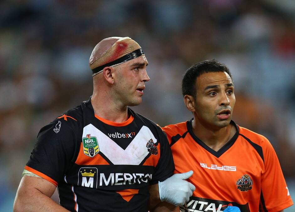 Liam Fulton is assisted from the field earlier this year after a head knock.