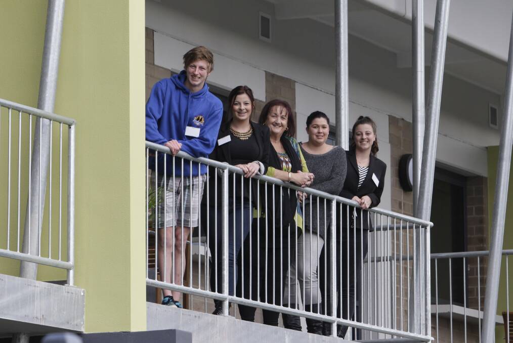 Youth Family Services in Warilla officially opens their refurbished units after government funding helped them secure the site over 2 years ago. The site has 20 units to be used as accommodation for youth who are homeless. CEO Narelle Clay (centre) with Steven, Rebecca, Rachel and Robyn on one of the balconies of the 1st floor units. Picture: ANDY ZAKELI