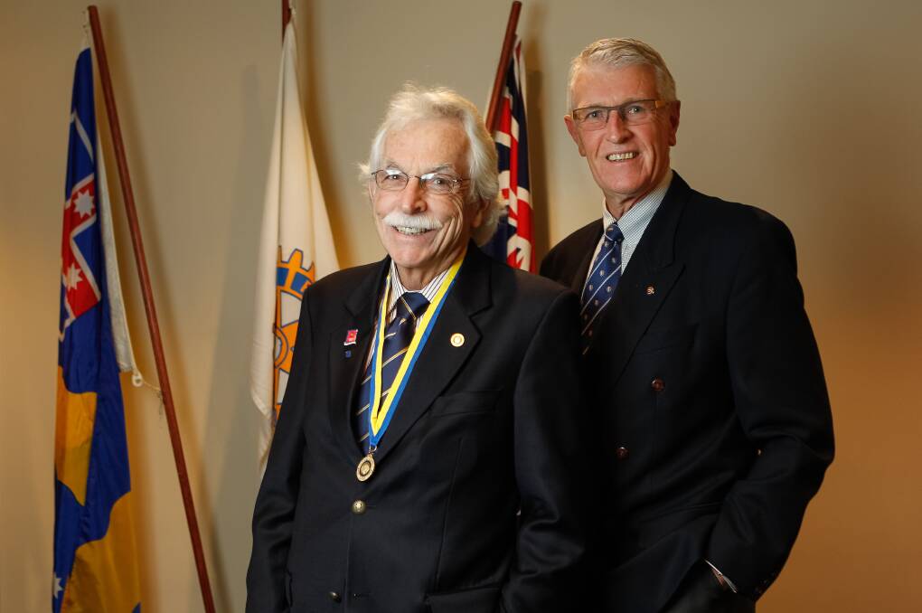 Paul Harris Fellow recipient and immediate past president Leigh Robinson with incoming Wollongong Rotary Club president Rod Oxley.  Picture: CHRISTOPHER CHAN
