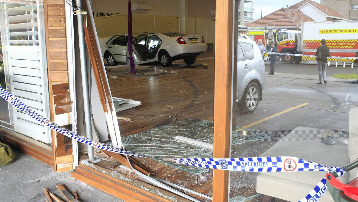 The car crashed through the building’s front glass window and through a double brick wall. Picture: ANDY ZAKELI