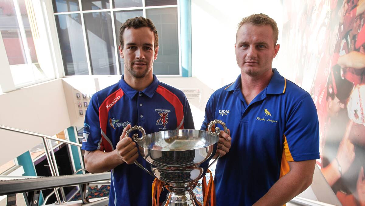 Wests’ Brad Scott and Matt Handcock, of Dapto, with the spoils of Saturday’s game.  Picture: CHRISTOPHER CHAN