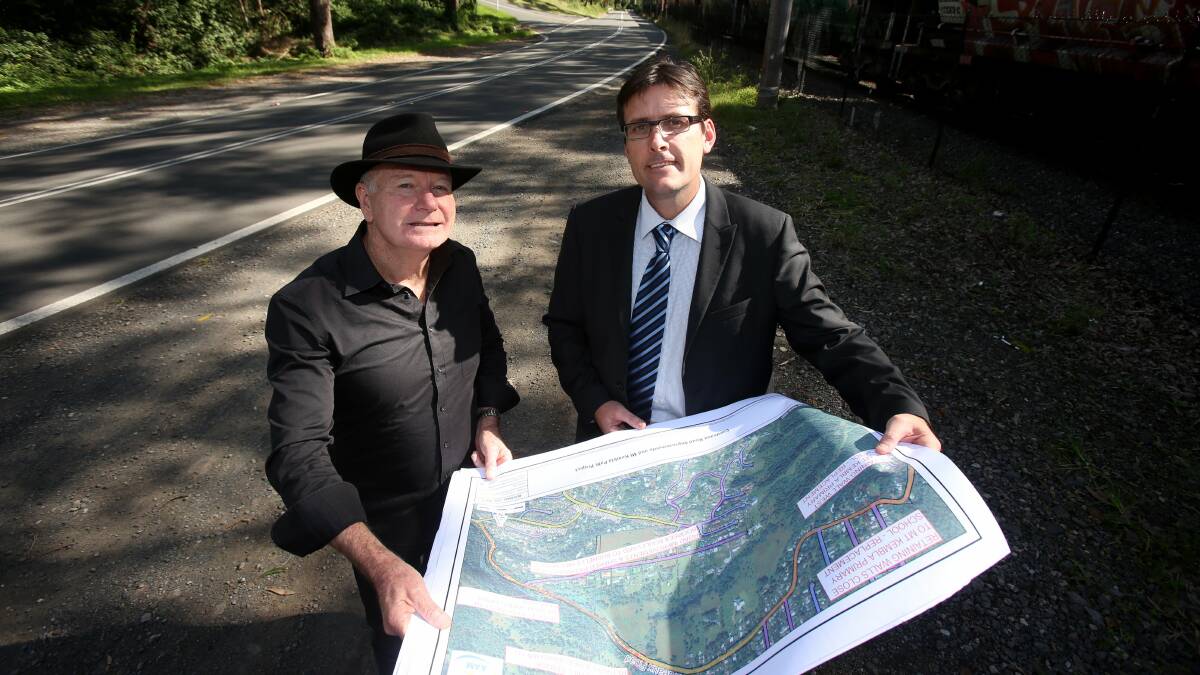 Lord Mayor Gordon Bradbery and Troy McDonald looking over plans for the new pathway. Picture: ROBERT PEET