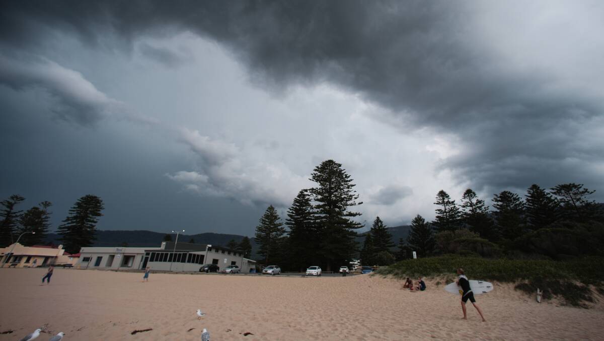 A thunderstorm rolls past Thirroul Beach on Monday afternoon. Picture: ADAM McLEAN
