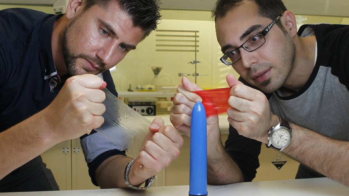 Research fellow Robert Gorkin and Sina Naficy at the University of Wollongong’s Centre of Excellence for Electromaterials Science  are designing a new material for condoms. Picture: ANDY ZAKELI