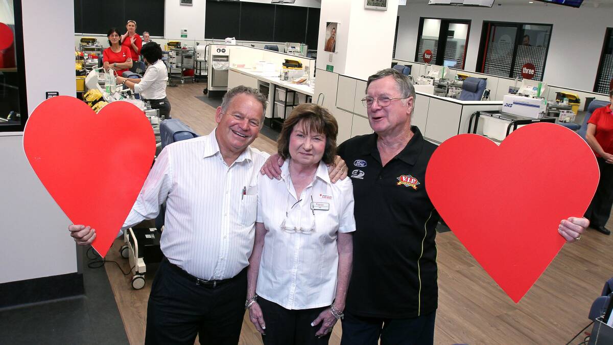 Phil Murray and Robert Turford with nurse Lucy Wright at the Red Cross blood donor centre in Kembla Street. Picture: KIRK GILMOUR