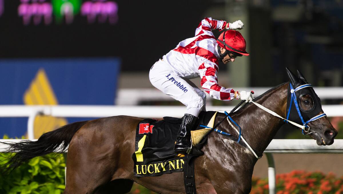 Brett Prebble rides Lucky Nine to win the 1200m Group 1 KrisFlyer International Sprint during the Singapore International Cup at the Singapore Turf Club. Picture: GETTY IMAGES