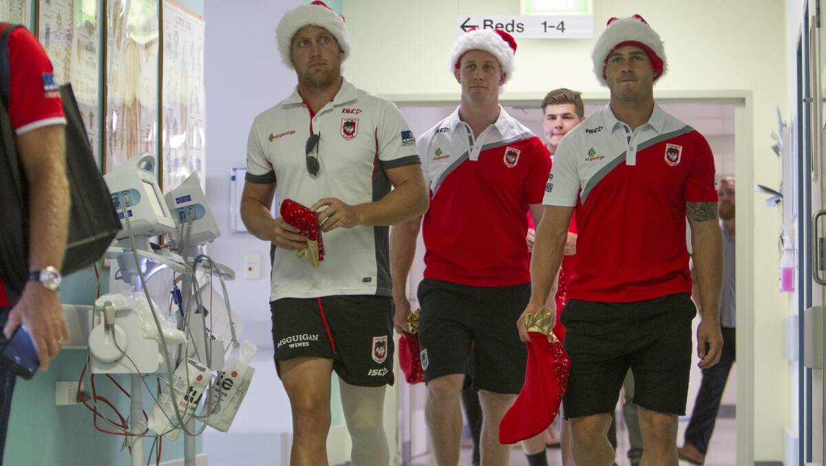 Dragons players Euan Aitken, Ben Creagh and Beau Henry at Wollongong Hospital. Picture: CHRISTOPHER CHAN