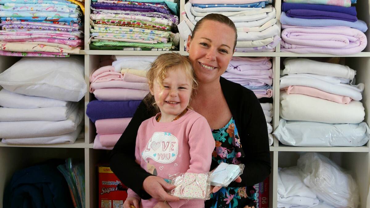 Balgownie's Tania Tree with daughter Isabella, who started Angel Baby Nappies. Photo: KIRK GILMOUR