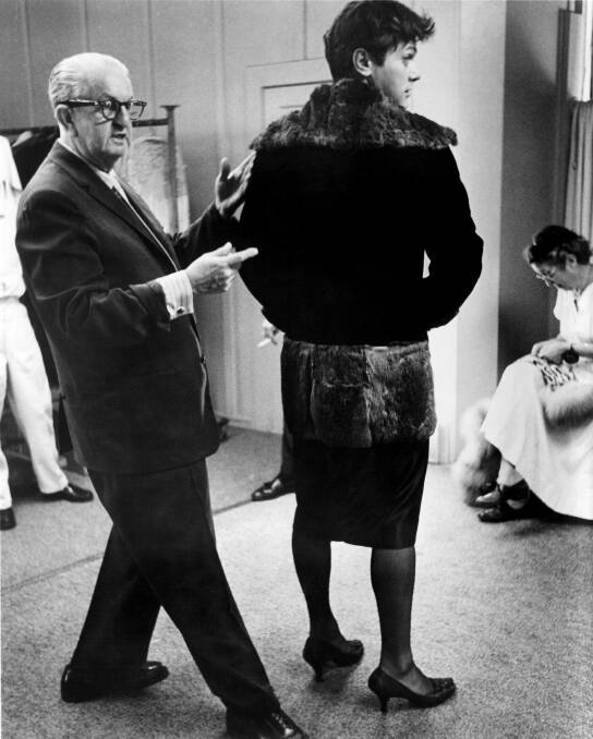 Kiama's Orry-Kelly dressing Tony Curtis for the Hollywood film Some Like It Hot. Picture: UNITED ARTISTS