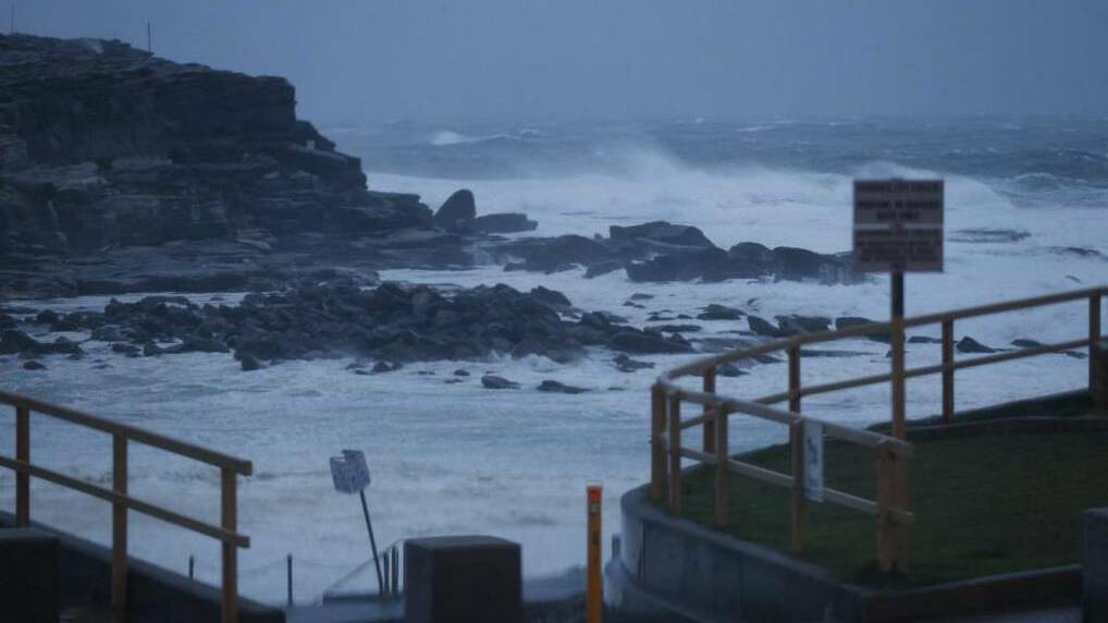 Rain and big waves lash Clovelly as a storm rolls across Sydney. Picture: PETER RAE