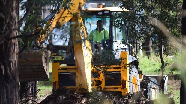 An excavator helps in the search for William Tyrell. Picture: NICK MOIR
