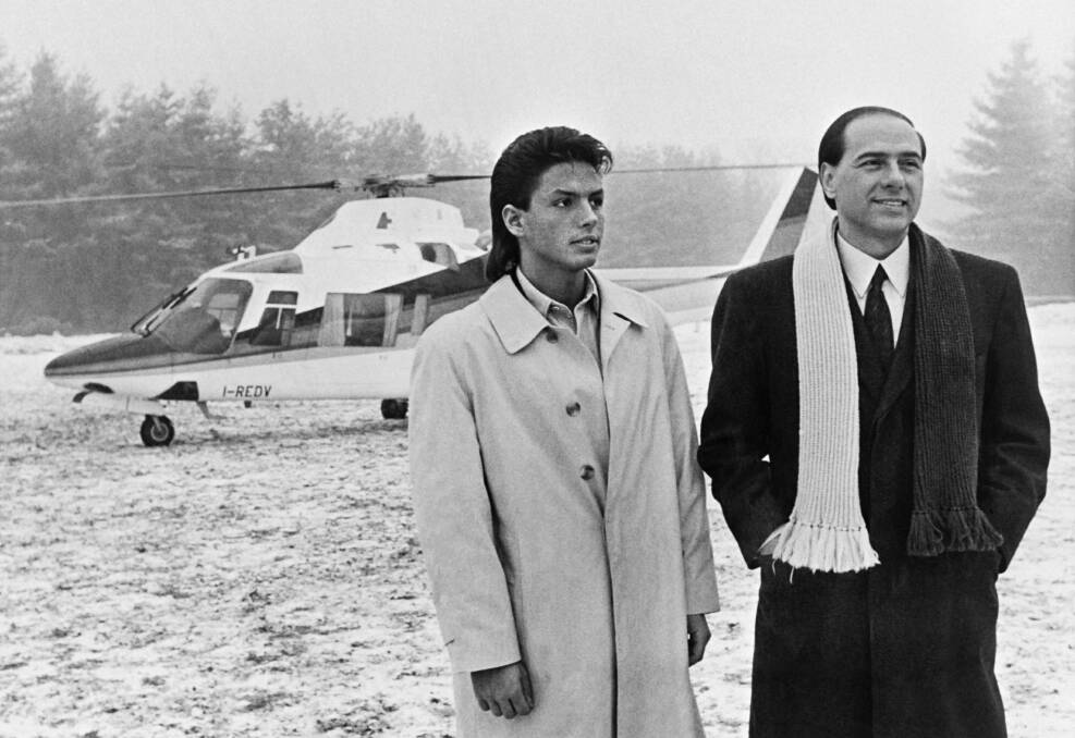 Then Italian TV manager Silvio Berlusconi with his son Pier Silvio in Milan, 1986.
AFP