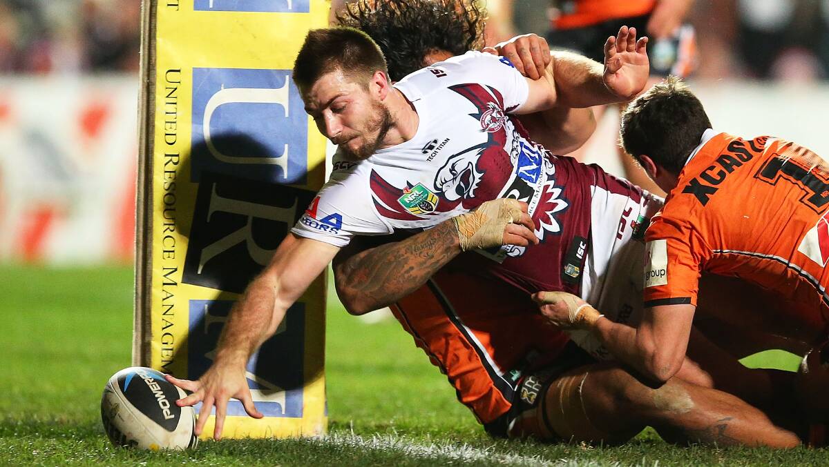 Kieran Foran scores for Manly against West Tigers at Brookvale Oval on Friday night. Picture: GETTY IMAGES