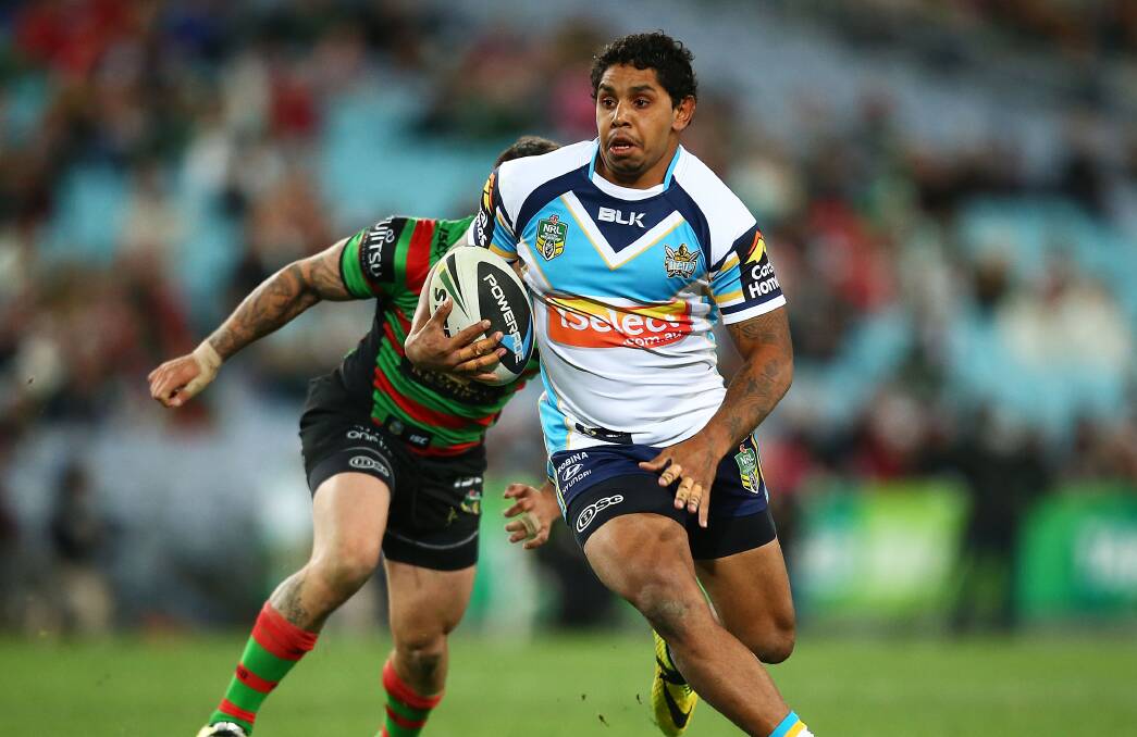 Gold Coast's Albert Kelly eludes the South Sydney defence during Monday night's NRL match at ANZ Stadium in Sydney. Picture: GETTY IMAGES