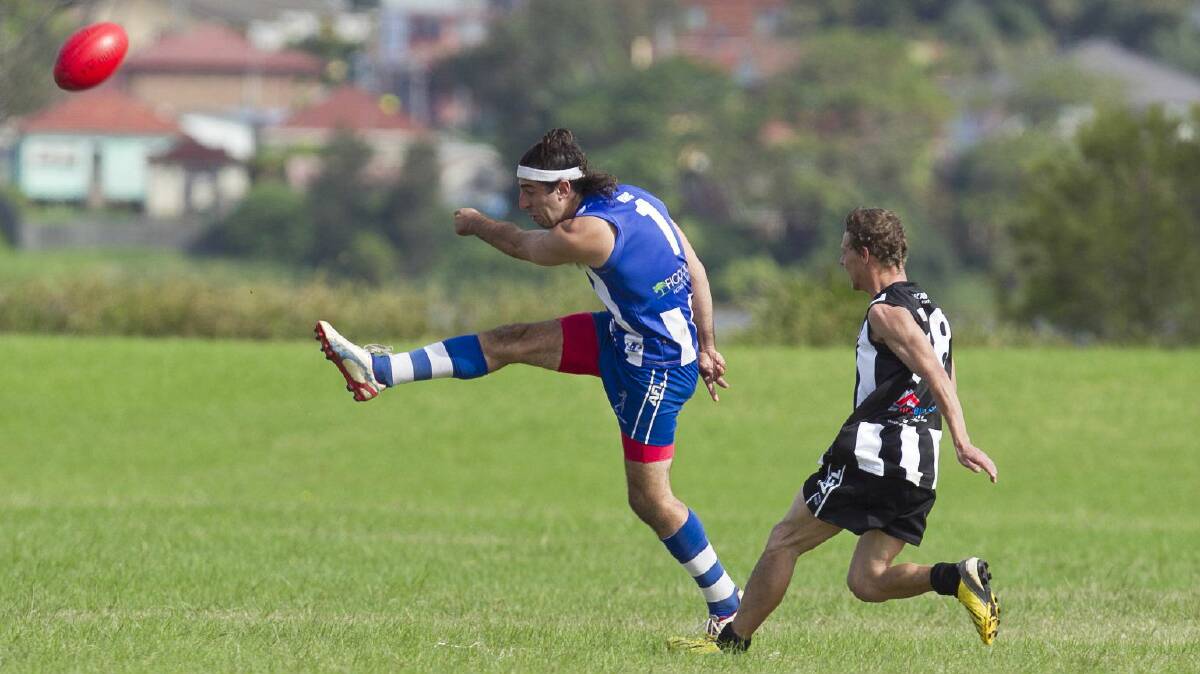 Figtree's Michael Biro kicks during the match against Port Kembla. Picture: SYLVIA LIBER