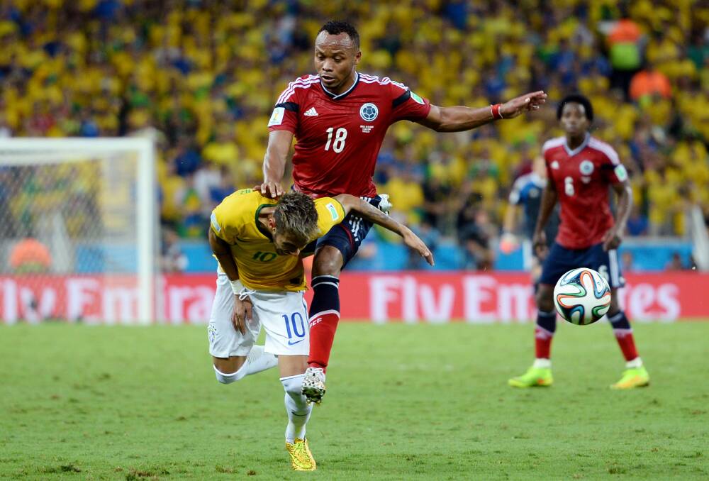 Colombia’s Juan Zuniga knees Brazil’s Neymar in the back which resulted in Neymar fracturing his vertebrae. Picture: GETTY IMAGES