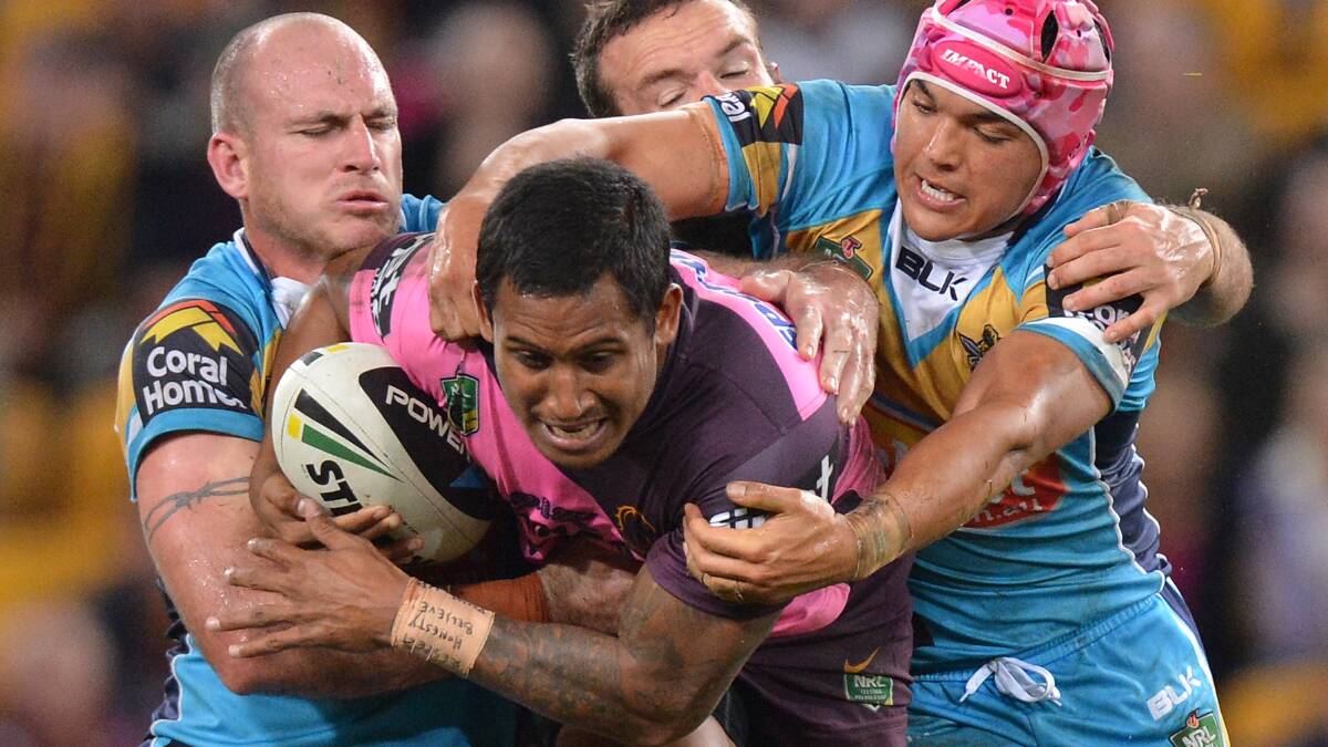 Ben Barba is sandwiched by Titans defenders. Picture: GETTY IMAGES