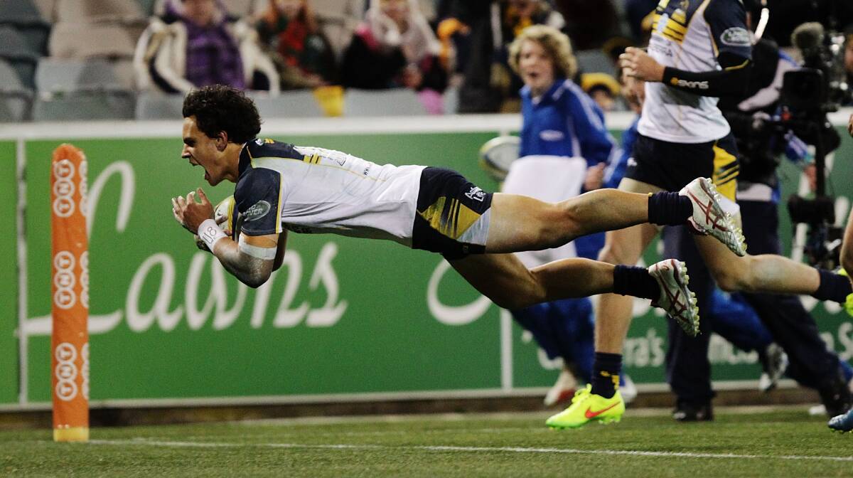 Brumbies back Matt Toomua scores one of his three tries against the Western Force at Canberra Stadium on Friday night. Picture: GETTY IMAGES