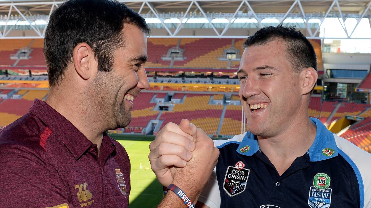 State of Origin skippers Cameron Smith (Queensland) and Paul Gallen (NSW)  meet before Game III at Suncorp Stadium. Picture: GETTY IMAGES
