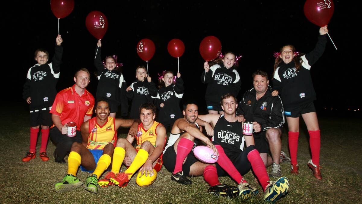 Port Kembla and Shellharbour players and supporters are united for Pink Sports Day in South Coast AFL Seniors. Front (left to right) Andy Wilton, Elwyn Roberts, Michael Talbott, Colin Heydon, Patrick Hammond and Brad Yates. (Back) Jayden Bright, Jorja Rickards, Lily Kopke, Jackson Kopke, Jorja Yates and Elli Rose Warren. Picture: SYLVIA LIBER
