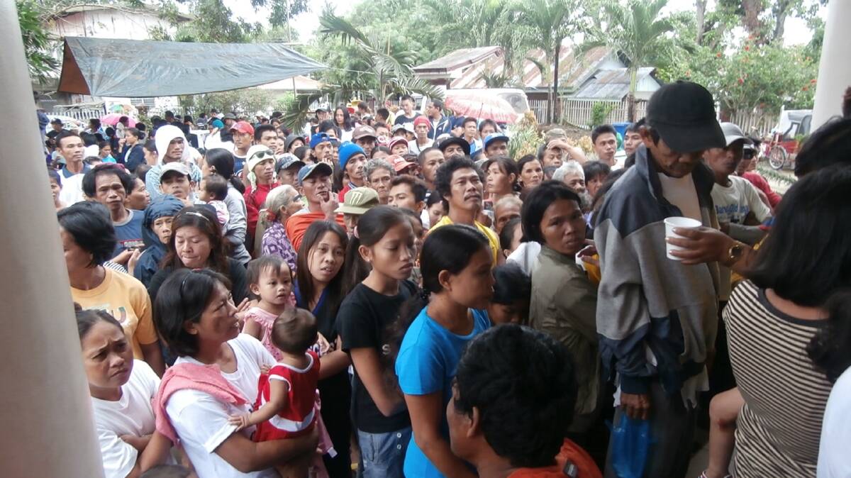 People in need line up for help in the city of Bacolod, in the Philippines. 