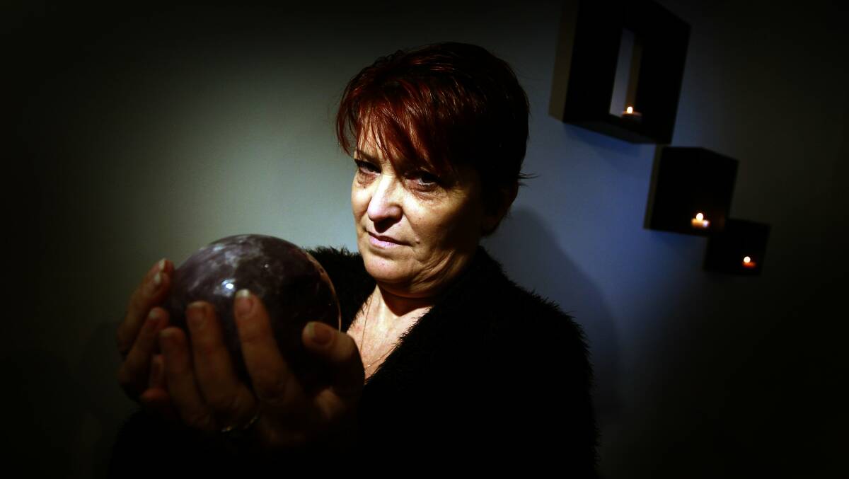 Port Kembla psychic Kerrie Barraclough doesn’t mind sharing her space with kindred spirits from the other side. Picture: SYLVIA LIBER