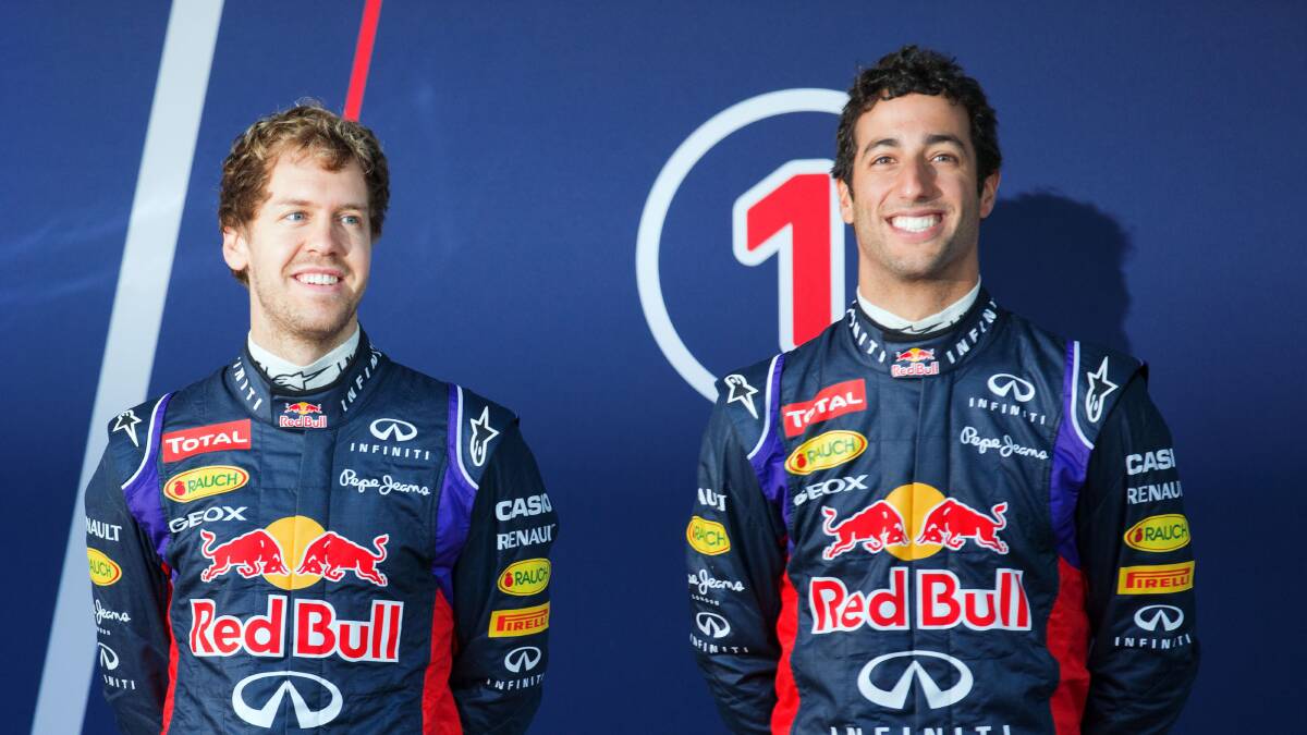 Ricciardo (at right) with his teammate, German champion Sebastian Vettel. Picture: CORBIS