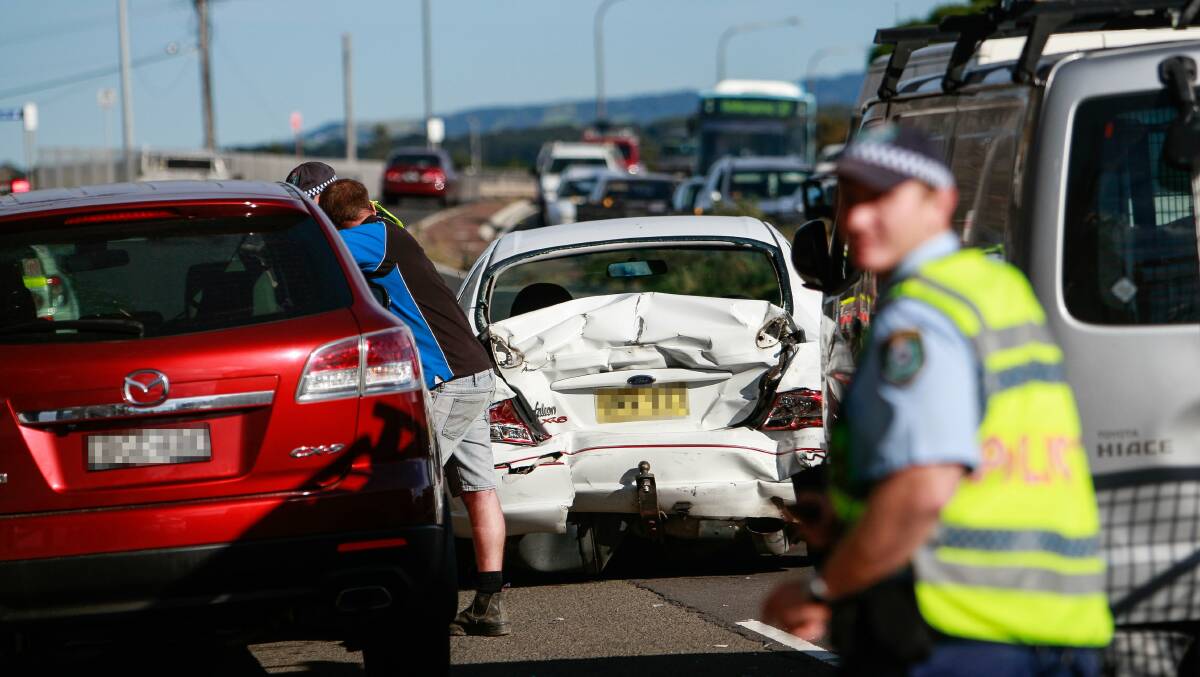 Three people were taken to Wollongong Hospital following a five car crash on Windang Road on Thursday. Pictures: CHRISTOPHER CHAN