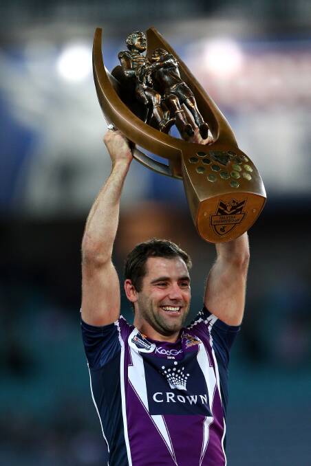 Cameron Smith of the Storm holds aloft the premiership trophy after winning the 2012 NRL grand final.