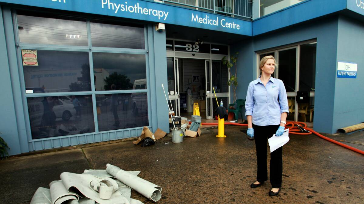 Jackie Donohoe of IOH Injury and Occupational Health in Swan Street after flash flooding in February 2012.