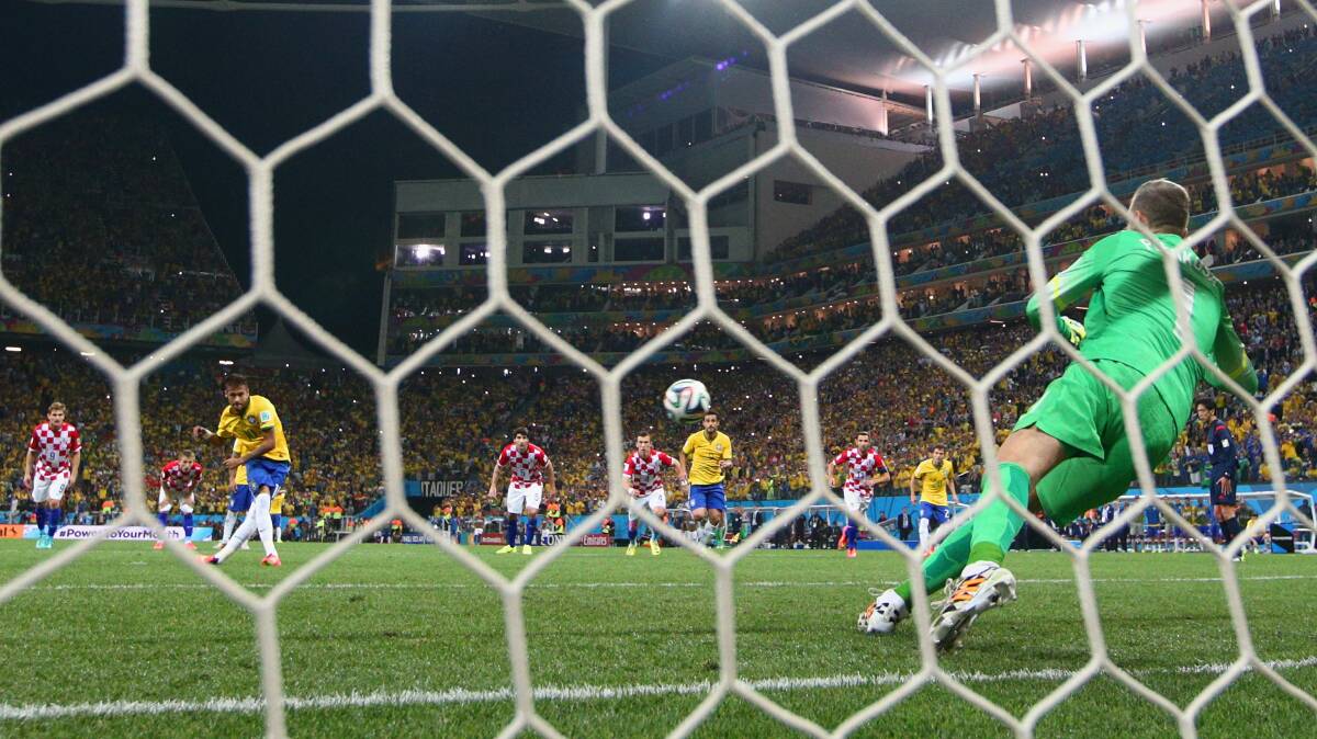 Neymar of Brazil celebrates scoring his second goal on a penalty kick in the second half during the group A match between Brazil and Croatia. Picture: GETTY IMAGES